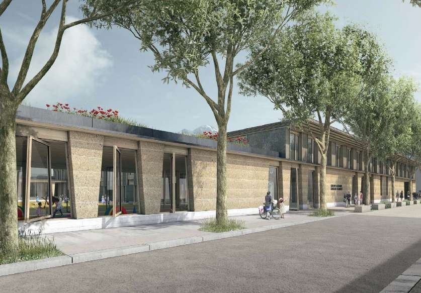 Groupe scolaire, vue depuis la rue Eugène Sue, murs en terre